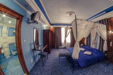 Фото номера Улучшенный двухместный номер с 1 кроватью Отель Predeal Comfort Suites г. Предял 9