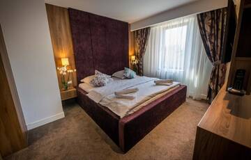 Фото номера Апартаменты Делюкс с камином и балконом Отель Eden Grand Resort г. Предял 7